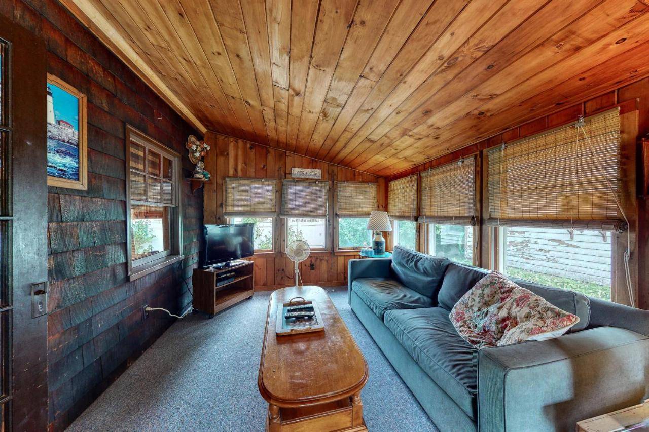 a living room with a couch and a coffee table at Otis Cottages in York