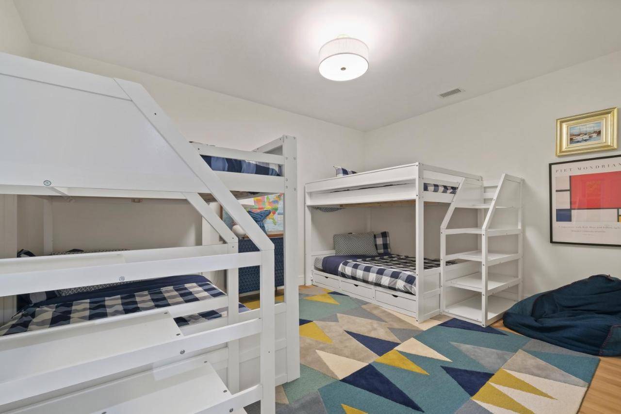 a room with two bunk beds and a rug at Private Oceanfront Estate with Tennis in York
