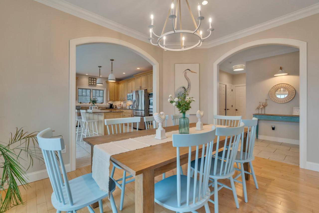 a dining room and kitchen with a table and chairs at The Hill Dog Friendly Panoramic Ocean Views in York
