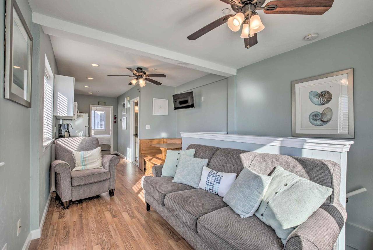 a living room with a couch and a ceiling fan at York Beachfront Condo - Steps to Long Sands! in York